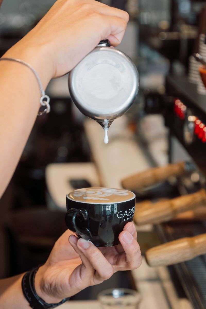Final drop of milk over a Gabriel Coffee latte