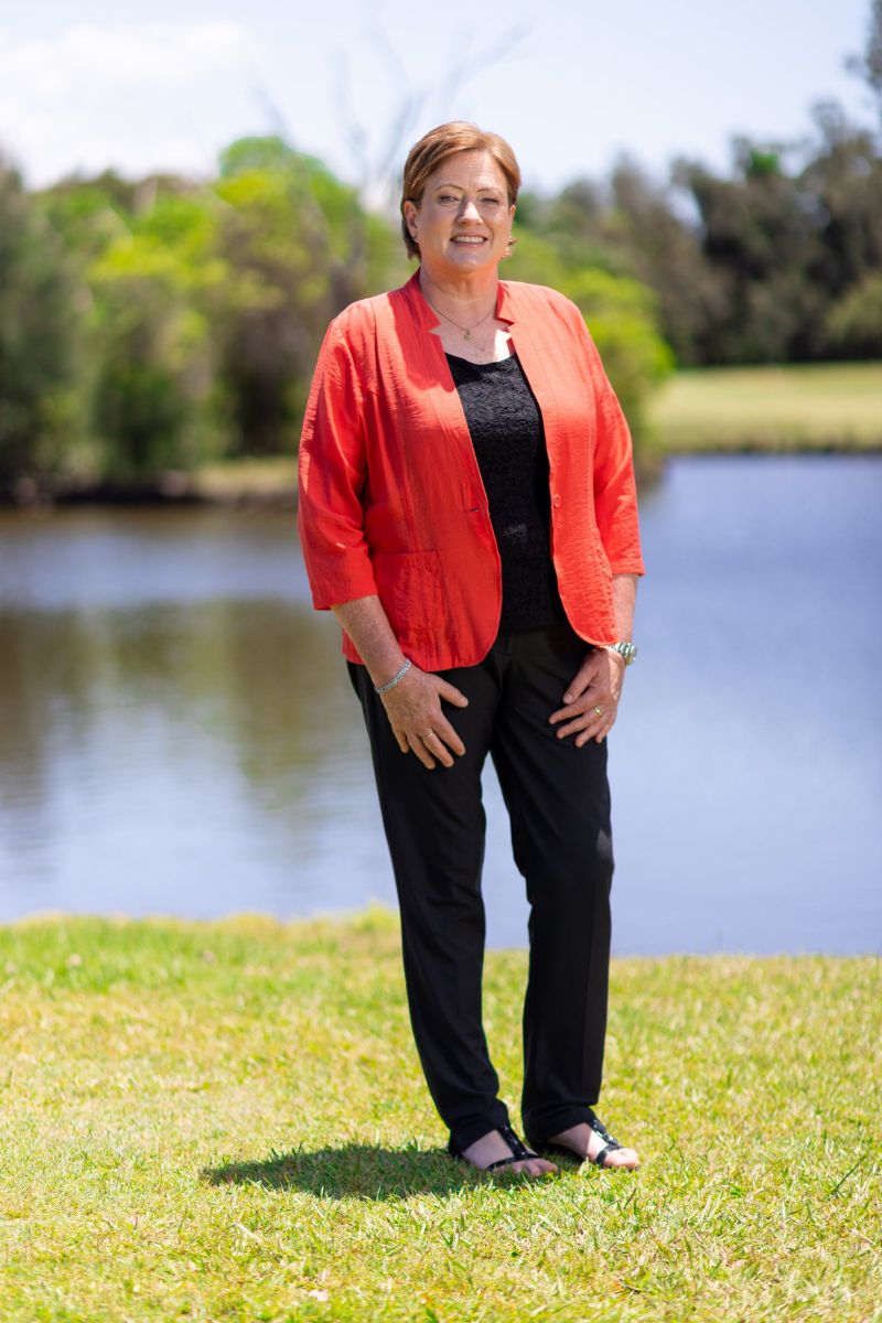 Environmental portrait of a golf industry leader by the lake